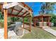 Outdoor kitchen area with built-in grill and pergola at 606 19Th W Ave, Palmetto, FL 34221