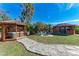 Landscaped backyard with multiple gazebos and hot tub at 606 19Th W Ave, Palmetto, FL 34221