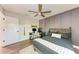 Bedroom with gray accent wall, built-in shelving, and ceiling fan at 606 19Th W Ave, Palmetto, FL 34221