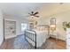 Charming bedroom with white bedding and built-in shelving at 606 19Th W Ave, Palmetto, FL 34221