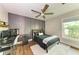 Modern bedroom with a workspace and dark-grey accent wall at 606 19Th W Ave, Palmetto, FL 34221