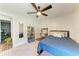 Cozy bedroom with built-in workspace and blue bedding at 606 19Th W Ave, Palmetto, FL 34221