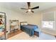 Bright bedroom with built-in workspace and blue bedding at 606 19Th W Ave, Palmetto, FL 34221