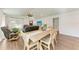 Dining area with wooden table and chairs, adjacent to living room at 606 19Th W Ave, Palmetto, FL 34221