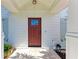 Red front door with white columns and shutters at 606 19Th W Ave, Palmetto, FL 34221