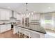 Modern kitchen with granite countertops and white cabinets at 606 19Th W Ave, Palmetto, FL 34221
