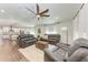 Living room with leather couches, hardwood floors, and kitchen view at 606 19Th W Ave, Palmetto, FL 34221