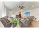 Living room with leather couches, hardwood floors, and a large TV at 606 19Th W Ave, Palmetto, FL 34221