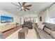Spacious living area featuring hardwood floors and a large TV at 606 19Th W Ave, Palmetto, FL 34221