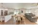 Open concept kitchen, dining, and living area with hardwood floors at 606 19Th W Ave, Palmetto, FL 34221