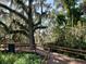 Wooden boardwalk path under large oak trees at 606 19Th W Ave, Palmetto, FL 34221