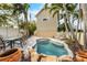 Inviting kidney-shaped pool surrounded by lush landscaping at 7000 Marina Dr, Holmes Beach, FL 34217