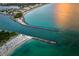 Aerial view of inlet with boats and beach at 932 Capri Isles Blvd # 216, Venice, FL 34292