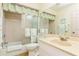 Bathroom with tub, toilet and updated vanity at 932 Capri Isles Blvd # 216, Venice, FL 34292