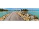 Seascape view of a paved walkway next to the ocean at 932 Capri Isles Blvd # 216, Venice, FL 34292