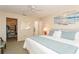Large bedroom with walk-in closet and bathroom access at 932 Capri Isles Blvd # 216, Venice, FL 34292