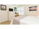 Bedroom with desk, dresser and window shutters at 932 Capri Isles Blvd # 216, Venice, FL 34292
