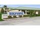 Golfvista community entrance sign with landscaping and paved road at 932 Capri Isles Blvd # 216, Venice, FL 34292