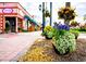 Scenic street view with flowers and shops at 932 Capri Isles Blvd # 216, Venice, FL 34292