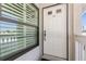 White front door and window with blinds at Golfvista at 932 Capri Isles Blvd # 216, Venice, FL 34292