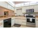 Well-equipped kitchen with stainless steel appliances at 932 Capri Isles Blvd # 216, Venice, FL 34292