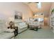 Spacious living room with vaulted ceiling, neutral decor, and comfy seating at 932 Capri Isles Blvd # 216, Venice, FL 34292