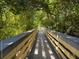 Boardwalk path through lush green foliage at 932 Capri Isles Blvd # 216, Venice, FL 34292