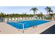 Community pool with plenty of lounge chairs at 932 Capri Isles Blvd # 216, Venice, FL 34292