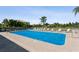 Inviting community pool with lounge chairs at 932 Capri Isles Blvd # 216, Venice, FL 34292