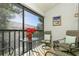 Peaceful screened balcony with small table and chairs at 932 Capri Isles Blvd # 216, Venice, FL 34292