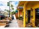 Daytime street view of shops and restaurants with outdoor seating at 932 Capri Isles Blvd # 216, Venice, FL 34292