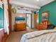 Vintage bedroom with TV, dresser, and a neutral color palette at 1000 Dartmouth Dr, Bradenton, FL 34207