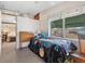 Bedroom with antique desk and view into another room at 1000 Dartmouth Dr, Bradenton, FL 34207