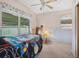 Bright bedroom featuring cozy bed, window with curtains, and classic decor at 1000 Dartmouth Dr, Bradenton, FL 34207