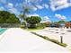 Resort-style pool with lounge chairs and patio tables at 1000 Dartmouth Dr, Bradenton, FL 34207