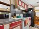 Galley kitchen with ample counter space and a stove at 1000 Dartmouth Dr, Bradenton, FL 34207