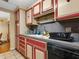 Vintage kitchen with red and white cabinets, classic countertops, and functional appliances at 1000 Dartmouth Dr, Bradenton, FL 34207