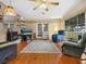 Spacious living room with hardwood floors, fireplace, and large windows at 1000 Dartmouth Dr, Bradenton, FL 34207
