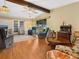Spacious living room with hardwood floors, ceiling fan, and ample seating at 1000 Dartmouth Dr, Bradenton, FL 34207
