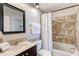 Bathroom with tub, shower, and dark vanity at 10125 Manatee W Ave # D3, Bradenton, FL 34209