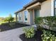 Inviting front entrance with landscaping and walkway at 10433 Morning Mist Ln, Sarasota, FL 34241