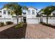 Two-story townhome with attached garage and landscaped front yard at 12439 Trailhead Dr, Bradenton, FL 34211