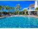 Sparkling community pool with palms at 14316 Skipping Stone Loop, Parrish, FL 34219