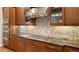 Granite countertops and stainless steel appliances in kitchen at 1609 Palm View Rd, Sarasota, FL 34240