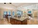 Open kitchen with large island and Gathering room view at 1609 Palm View Rd, Sarasota, FL 34240