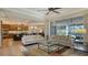 Living room with kitchen view, fireplace, and sliding doors to lanai at 1609 Palm View Rd, Sarasota, FL 34240