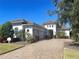 Two-story home with tile roof, three-car garage, and landscaped yard at 16907 Verona Place, Lakewood Ranch, FL 34202