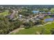 Aerial view of house and surrounding golf course community at 1965 White Feather Ln, Nokomis, FL 34275
