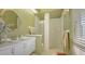 Clean bathroom with vanity, toilet, and walk-in shower at 1965 White Feather Ln, Nokomis, FL 34275
