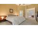 Spacious Primary bedroom with ample light and en-suite bathroom access at 1965 White Feather Ln, Nokomis, FL 34275